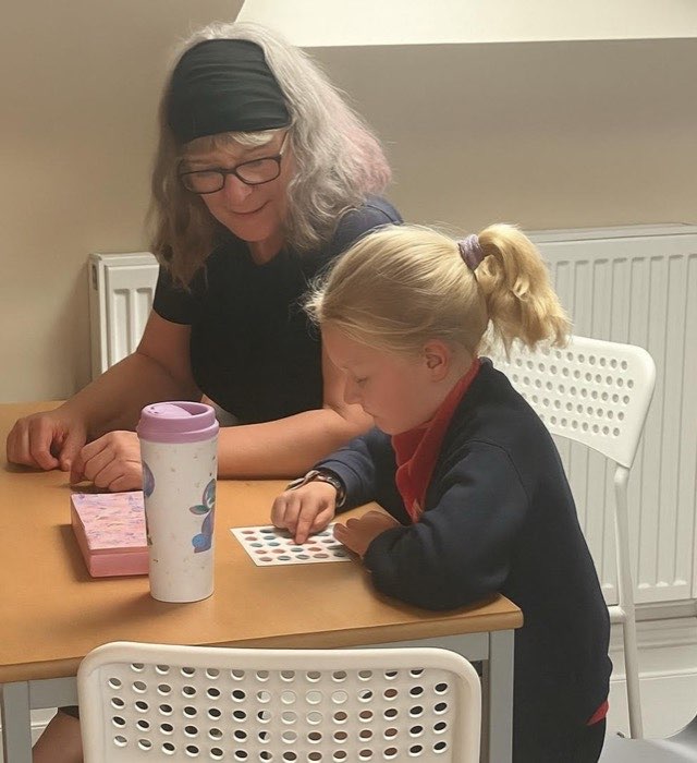 A Learn North West teacher working one-to-one with a pupil